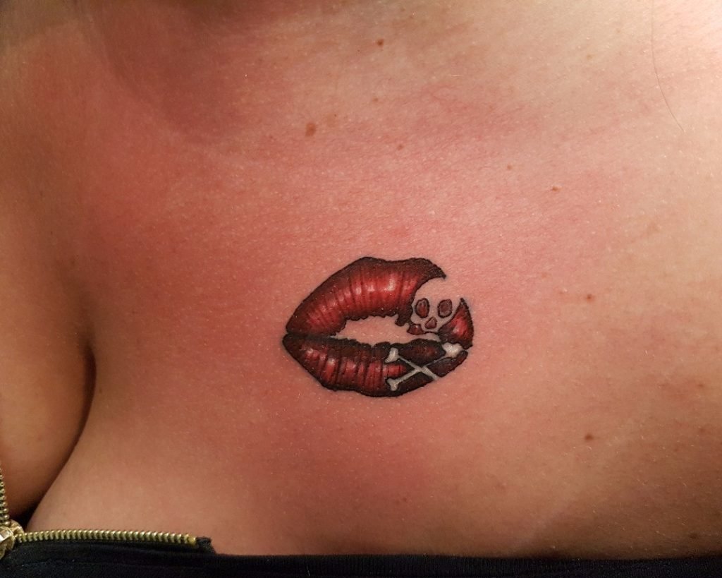 Skull & crossbones/lips tattoo